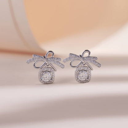 ELOREVA Bow Moissanite Stud Earrings 5mm – Platinum Plated 925 Sterling Silver (GRA Certified)